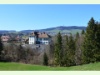 Château de Vuippens und der Höhenzug Gibloux im Hintergrund